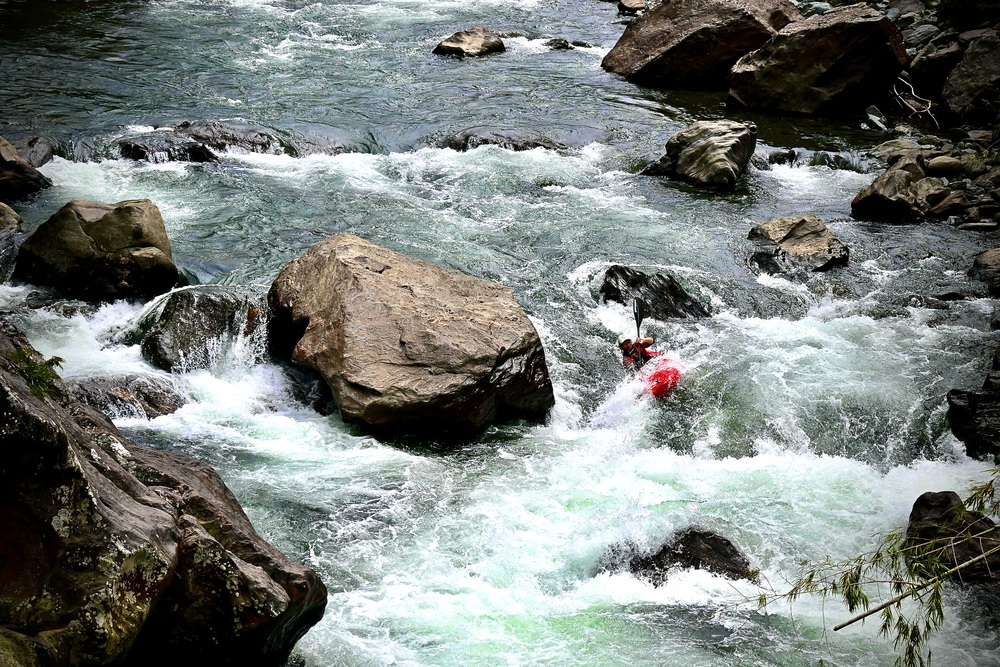 Jules Dominé leading a river expedition in Colombia
