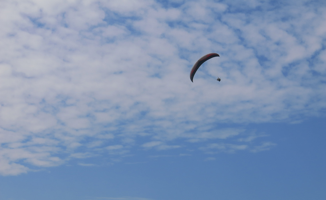 paraglider with blue sky