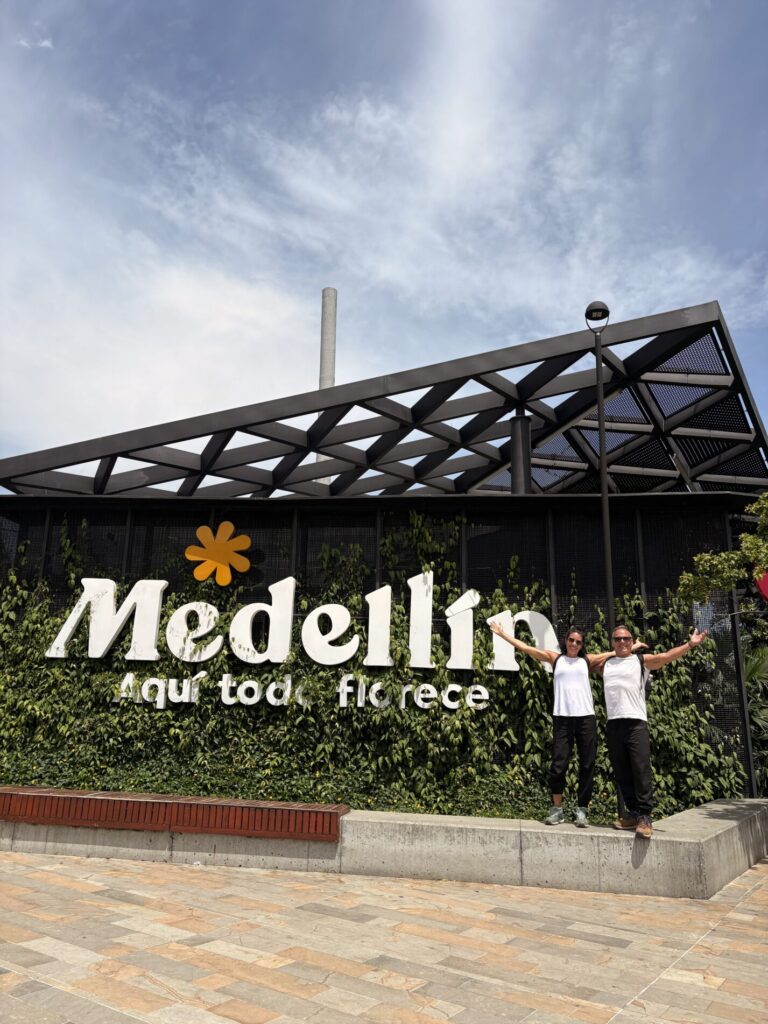 Bilingual guide explaining local history during Medellín city tour