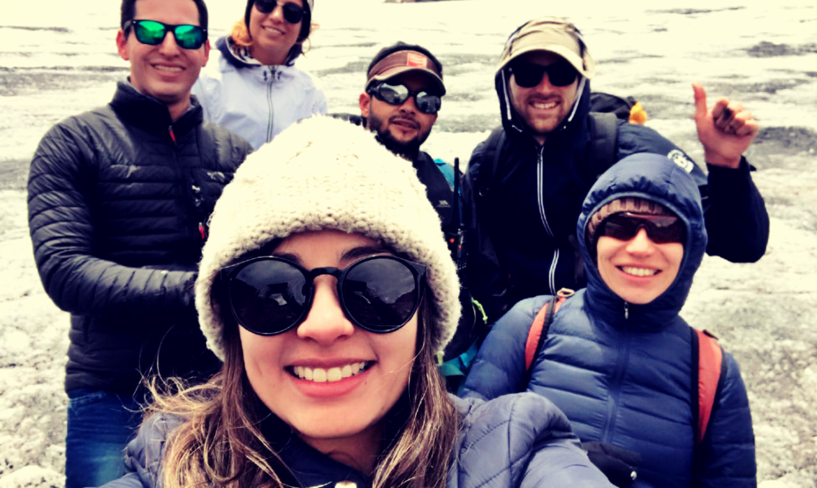 Group of hikers crossing a wooden bridge in the Cedral area
