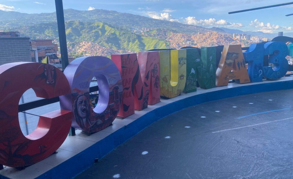 Scenic lookouts in Comuna 13, Medellín, offering panoramic views of the city and surrounding mountains, highlighting the neighborhood's transformation and cultural revival