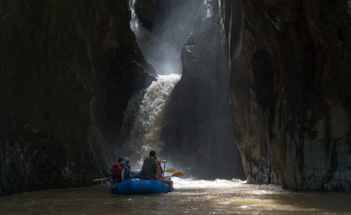 cave waterfall rafting group