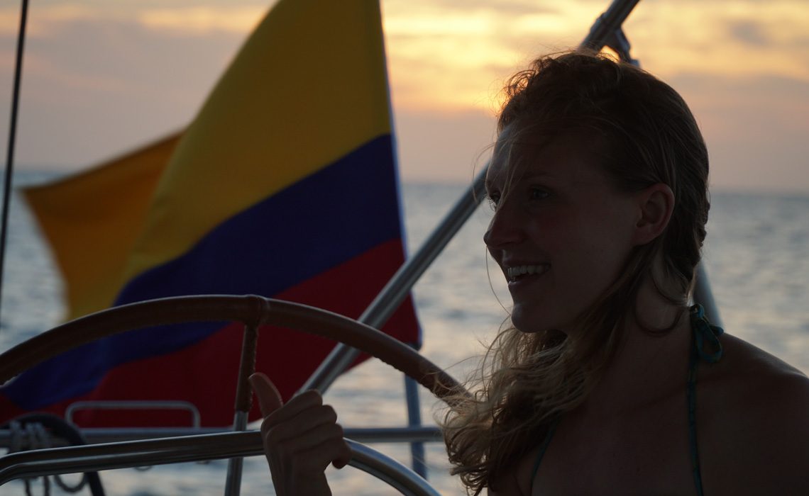 woman happy sunset colombian flag