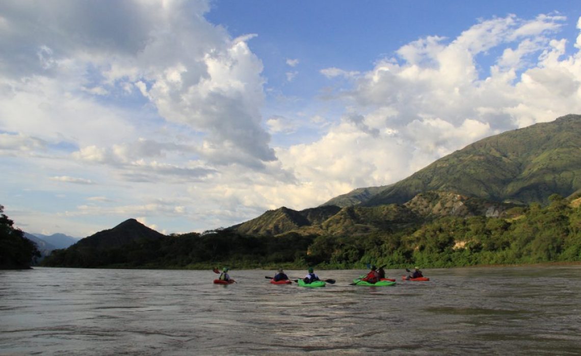 Group paddling into canyon of Cauca