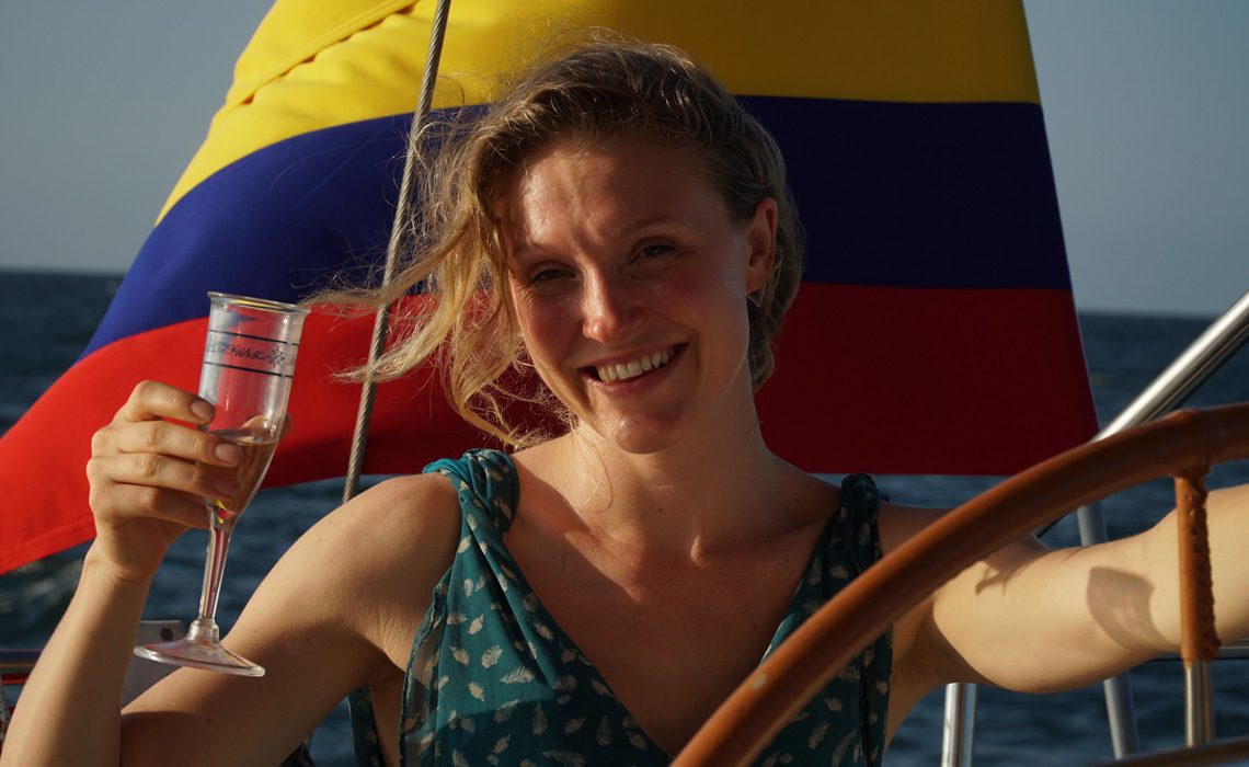 woman happy sailing colombian flag