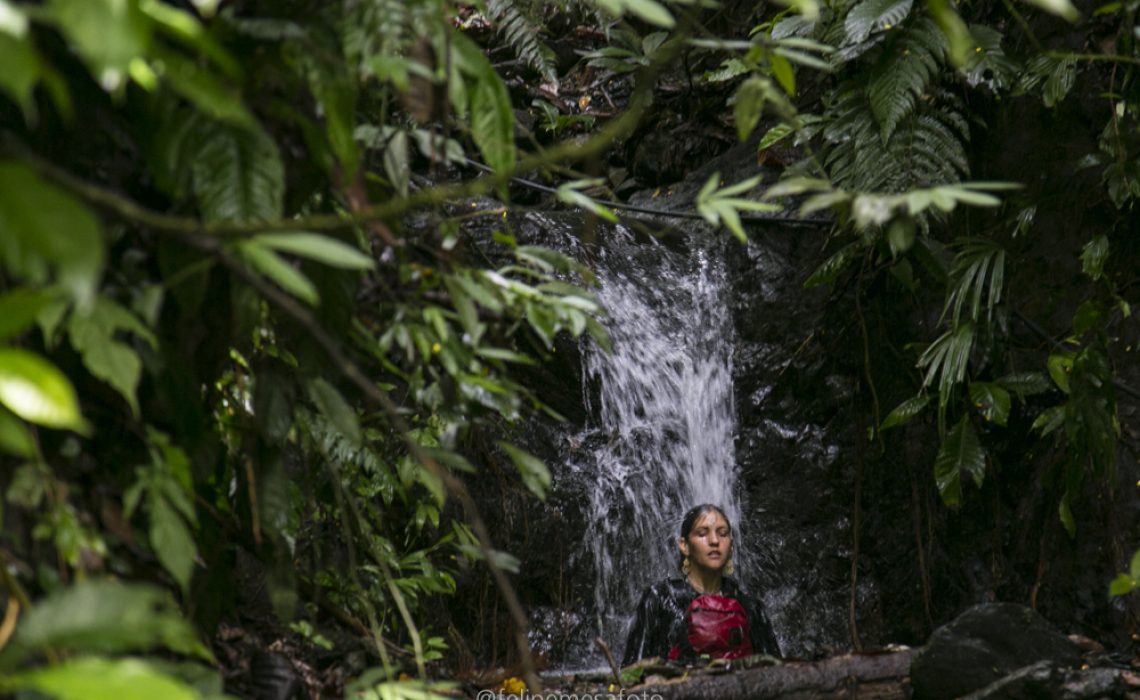 woman waterfall jungle